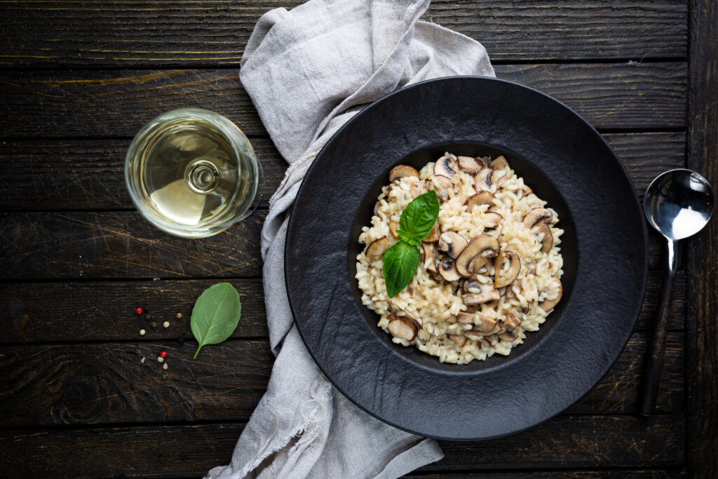 Risotto with mushrooms in a plate - Restaurant Riedenburg